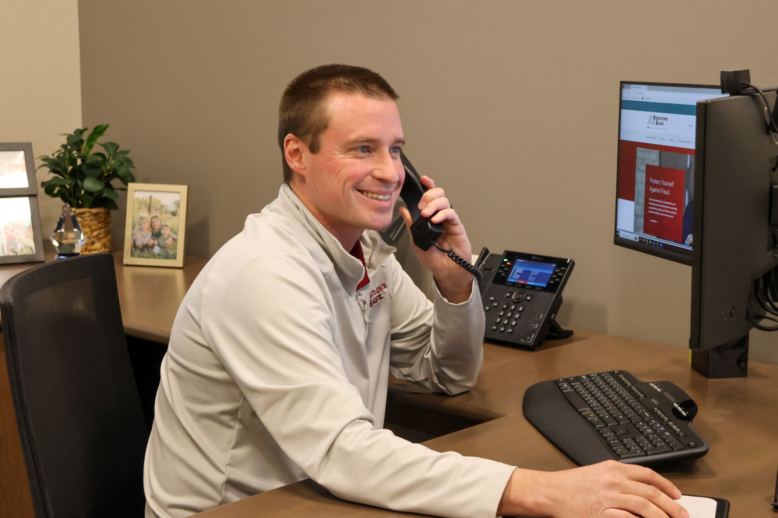 Dillon Joslyn of the Parker Branch talking on the phone to a client.